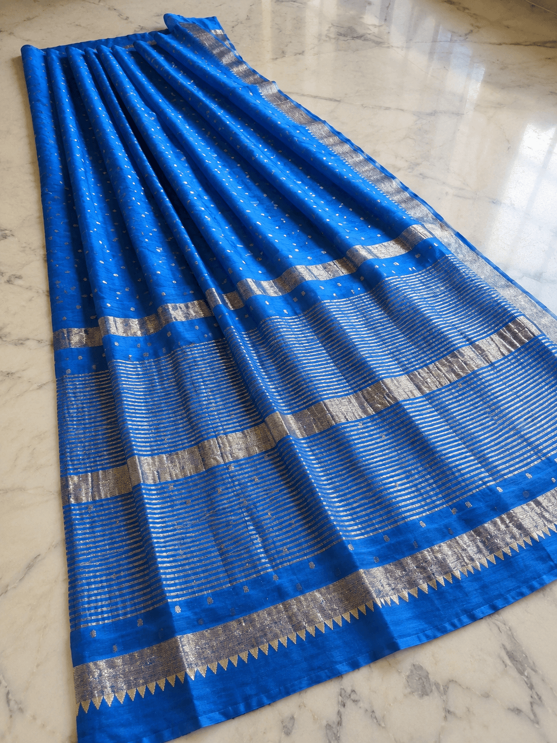 royal blue sari on marble floor